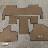 Brown Kia EV9 6-Passenger Carpet Floor Mats